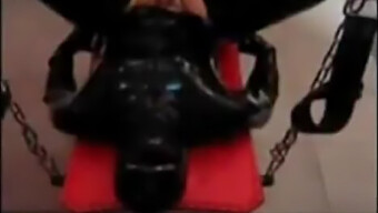 Masturbating While Dominating A Latex-Clad Submissive With A Strapon